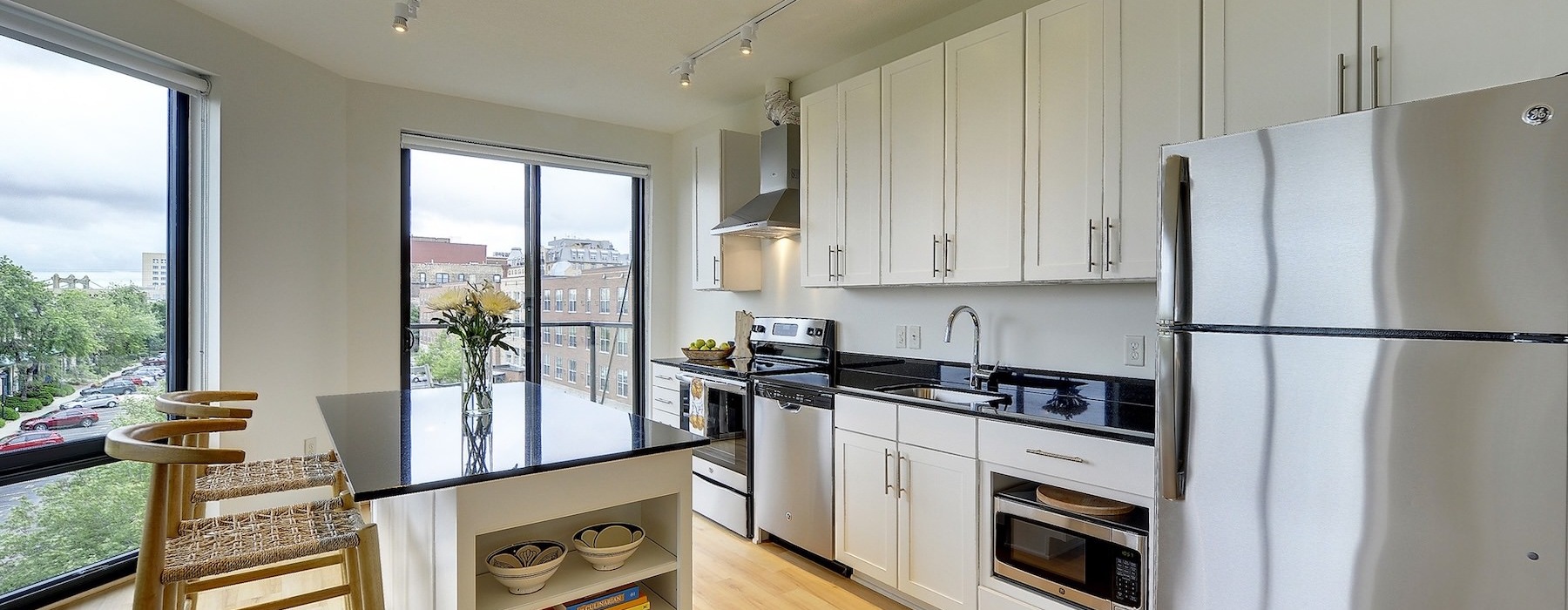 a kitchen with white cabinets