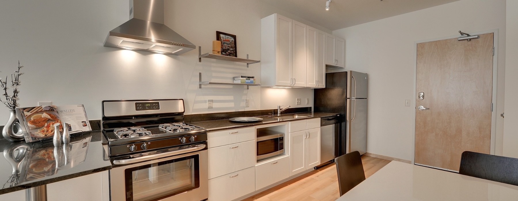 a kitchen with white cabinets