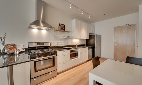 a kitchen with white cabinets